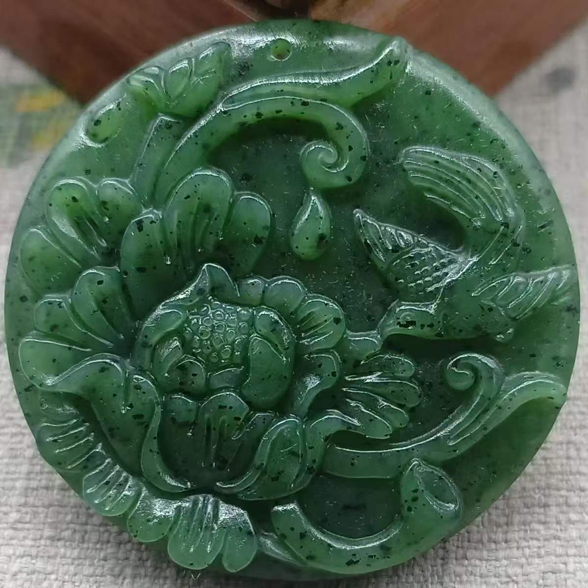 Natural jade Hetian nephrite flower pendant, round plaque with auspicious plum blossom design, apple green jade pendant.